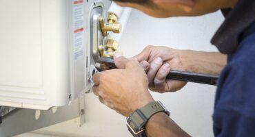 HVAC Professional Fixing HVAC System